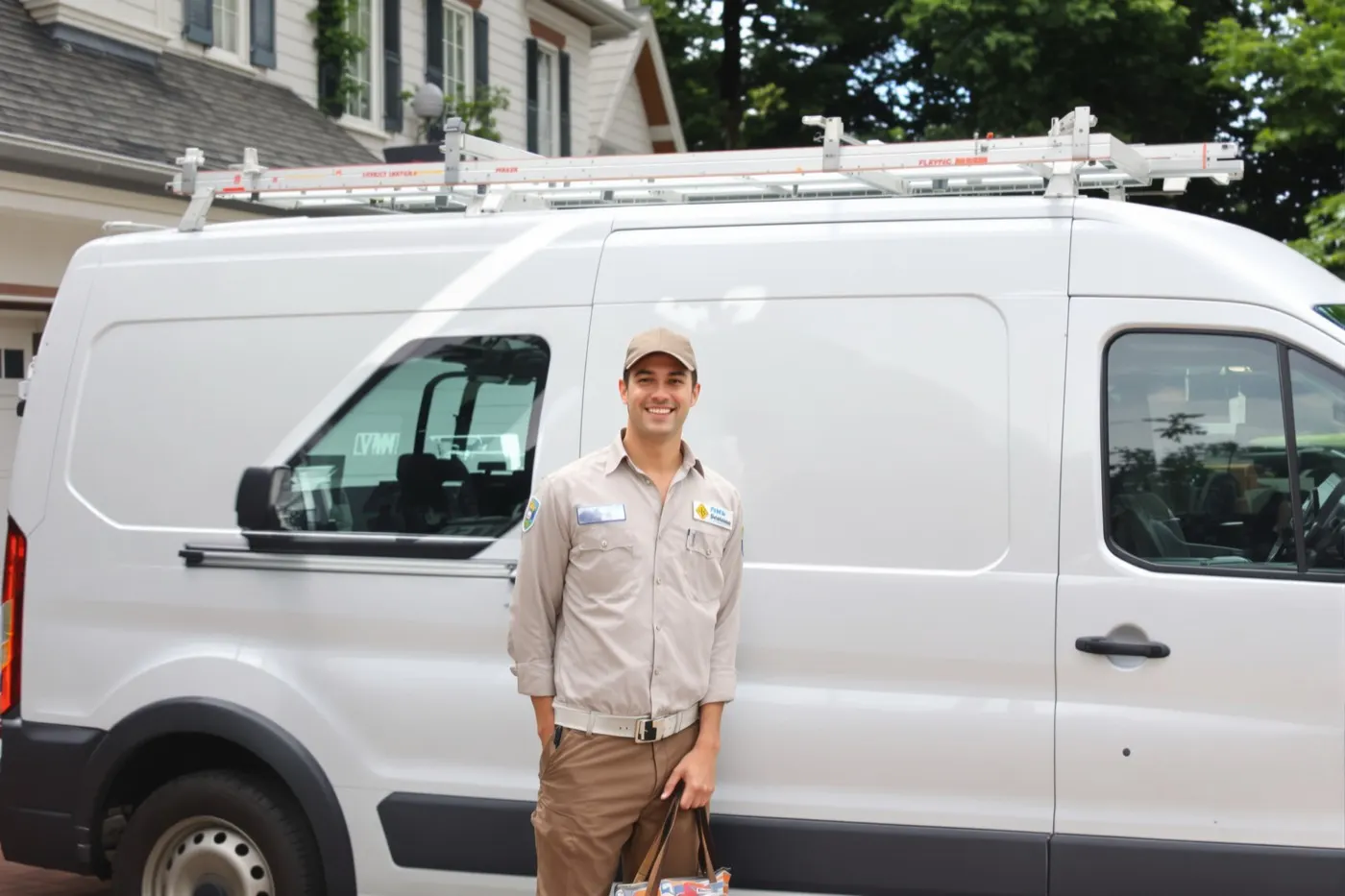 A local Grand Rapids electrician arriving at a home with a service van